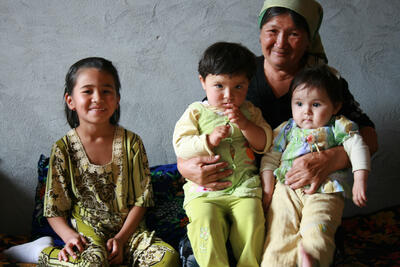 A central Asian family sit together