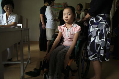 A girl in a wheelchair in Pyongyang